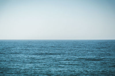 Close-up of blue sea against sky