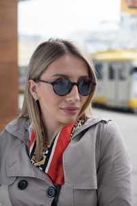 Portrait of young woman wearing sunglasses