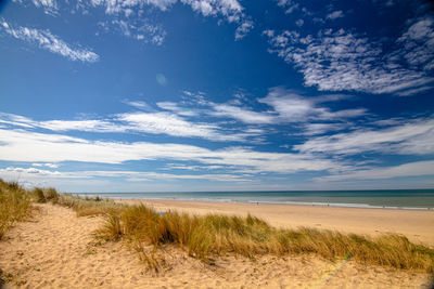 Scenic view of beach against sky