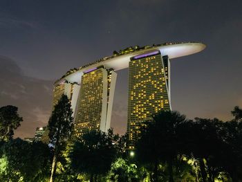 Low angle view of illuminated building against sky