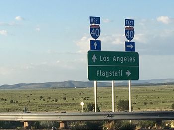 Road signs against sky