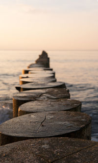 Wooden pier over sea against sky