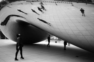 High angle view of people walking on footpath