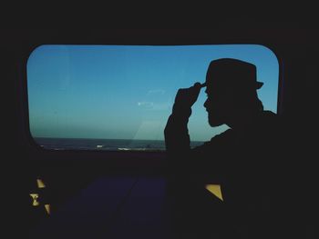 Silhouette of woman in sea