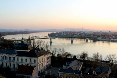 Bridge over river with buildings in background