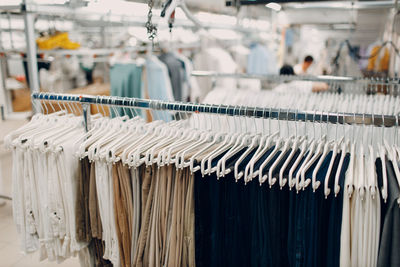 Close-up of clothes hanging in store