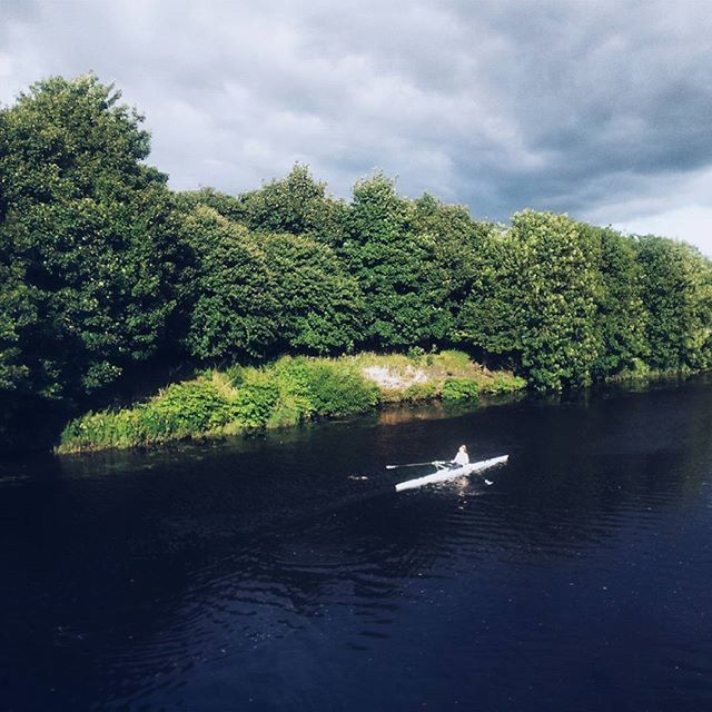 water, tree, sky, tranquility, tranquil scene, cloud - sky, lake, waterfront, beauty in nature, nature, scenics, reflection, cloud, cloudy, green color, river, growth, transportation, day, idyllic