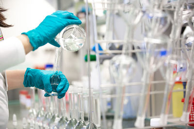 Cropped hands of scientist experimenting at laboratory