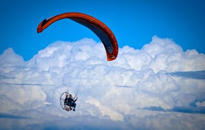 Low angle view of paragliding