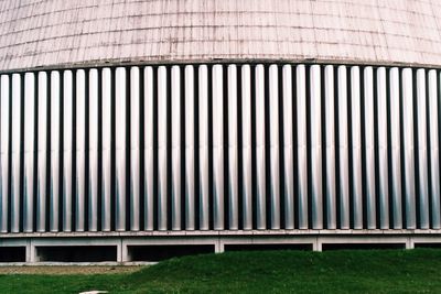 Metal structure in city against sky