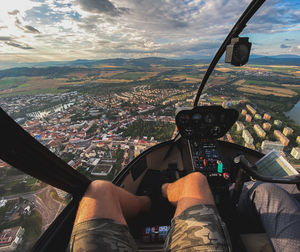 Midsection of man at airplane against sky
