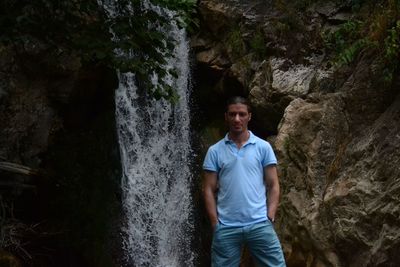 Full length of man standing on rock