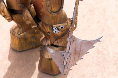 High angle view of warrior statue with axe on field