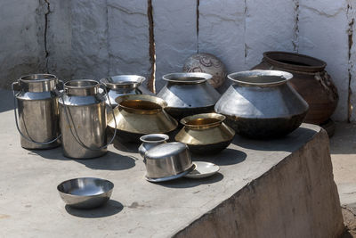 Close-up of metallic containers outdoors