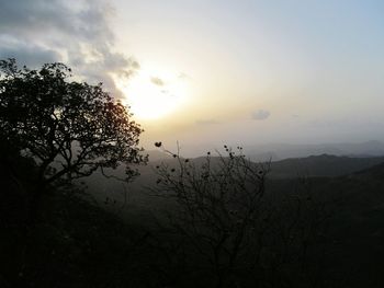 Scenic view of landscape against sky at sunset