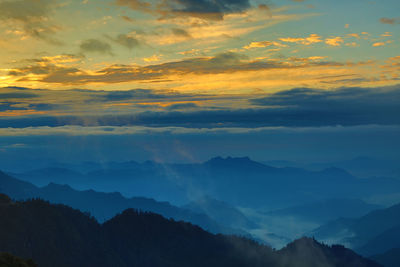 Scenic view of mountains against sky during sunset