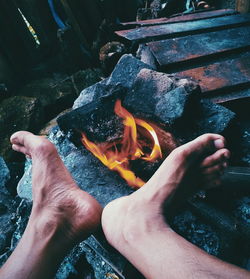 High angle view of hand holding fire