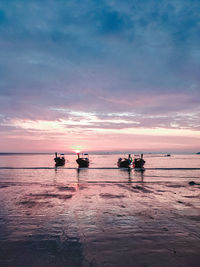 Sunset and beach sunset seaside long tail boat ship boat sea water beach sandy beach
