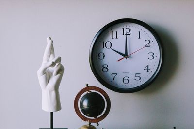 Close-up of clock on wall