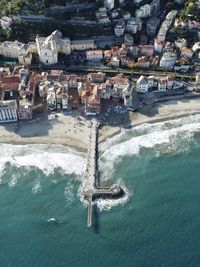 High angle view of townscape by sea