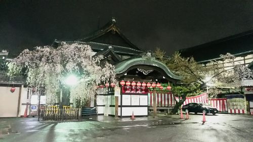 Illuminated city against sky during winter