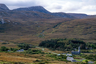 Scenic view of landscape and mountains against sky