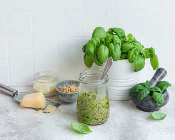 Fresh made pesto sauce. green basil pesto. ingredient for pesto sauce 