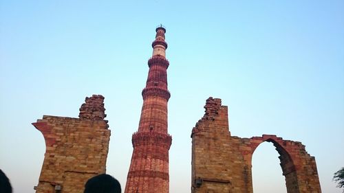 Low angle view of old ruin against clear blue sky