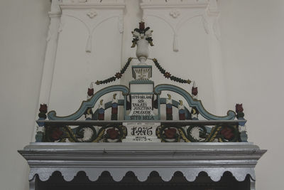 Low angle view of statue against temple