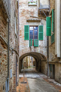 Empty alley amidst buildings