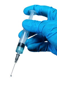 Low angle view of human hand against white background