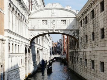 View of bridge over canal in city