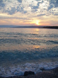 Scenic view of sea at sunset