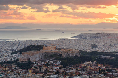 View of acropolis and city of athens from lycabettus hill at sunset.