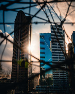 Low angle view of buildings against sky during sunset