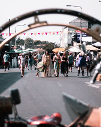 People walking on road in city