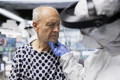 Portrait of young man smoking cigarette