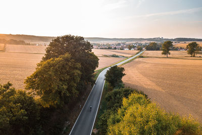 Road cyclist riding on an empty road in germany.