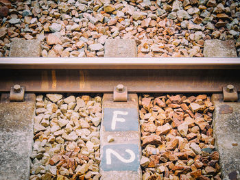High angle view of stones on railroad track