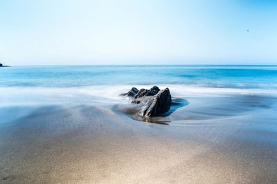 Scenic view of sea against clear sky