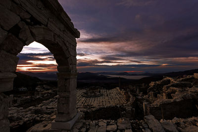 View of old ruins against sky during sunset