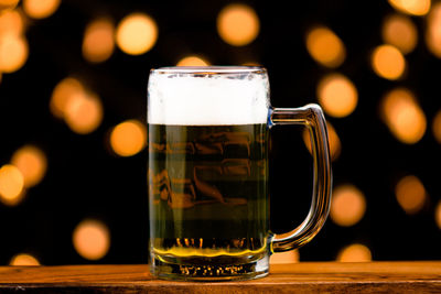 Close-up of beer glass on table