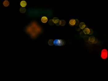 Defocused image of lights over black background