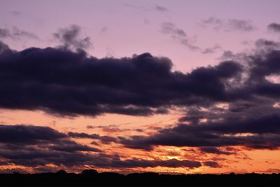 Low angle view of dramatic sky during sunset