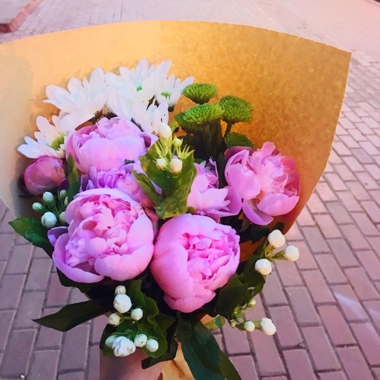 flower, freshness, petal, fragility, flower head, pink color, high angle view, beauty in nature, growth, bouquet, indoors, plant, nature, bunch of flowers, rose - flower, table, close-up, leaf, flower arrangement, vase