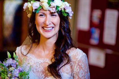 Close-up of happy bride looking away