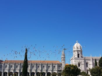 View of buildings against blue sky