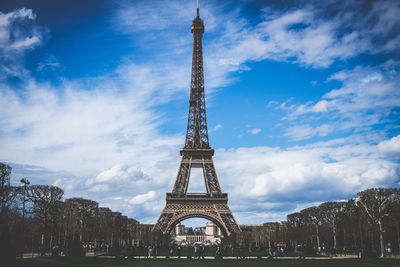 Low angle view of tower against cloudy sky