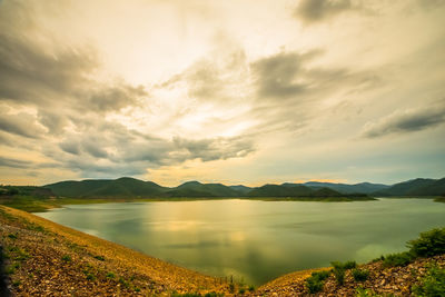 Scenic view of lake against sky during sunset