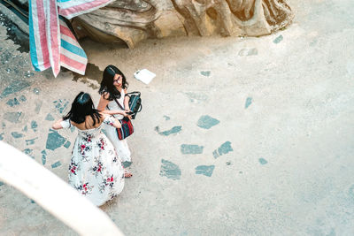 High angle view of woman looking at camera